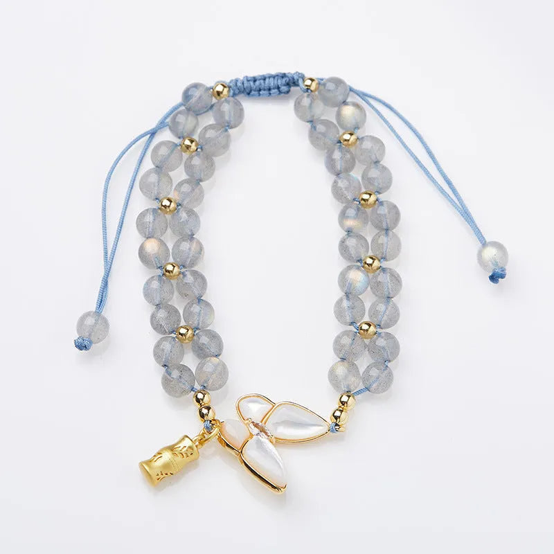 Grey moonstone woven bracelet for women with geometric design and butterfly detailing