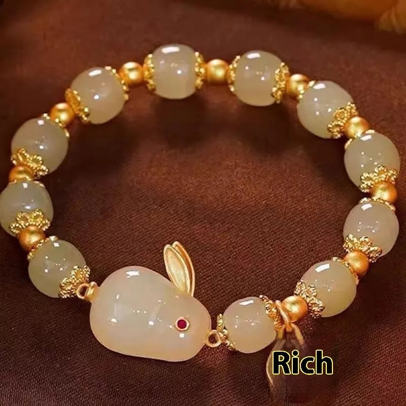 Green jade hare bracelet for women with Chinese style zodiac animal design and lily decorations