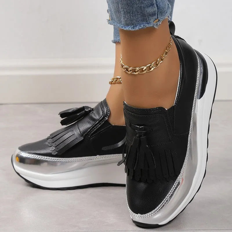 Women's black casual platform shoes with tassel detail and wedge heel