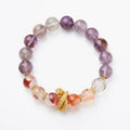 Purple cornucopia crystal bracelet with nine purple lucky charms on wrist
