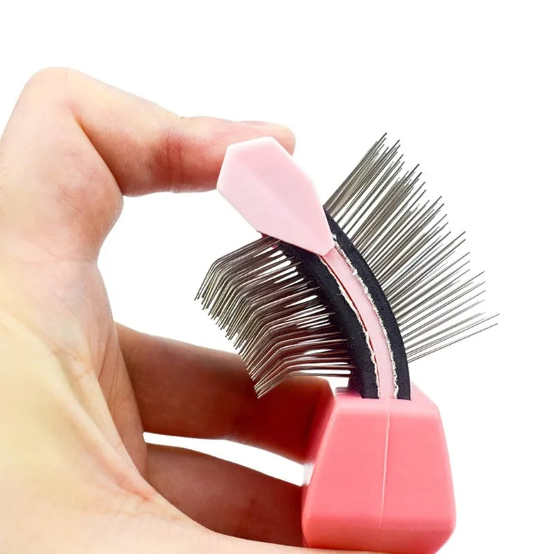 Blue double-sided pet brush with stainless steel pins and ergonomic handle on a white background.