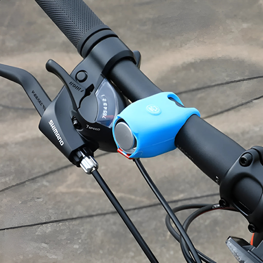 A black electronic bicycle horn with buttons, shown next to two 2032 batteries on a white background.