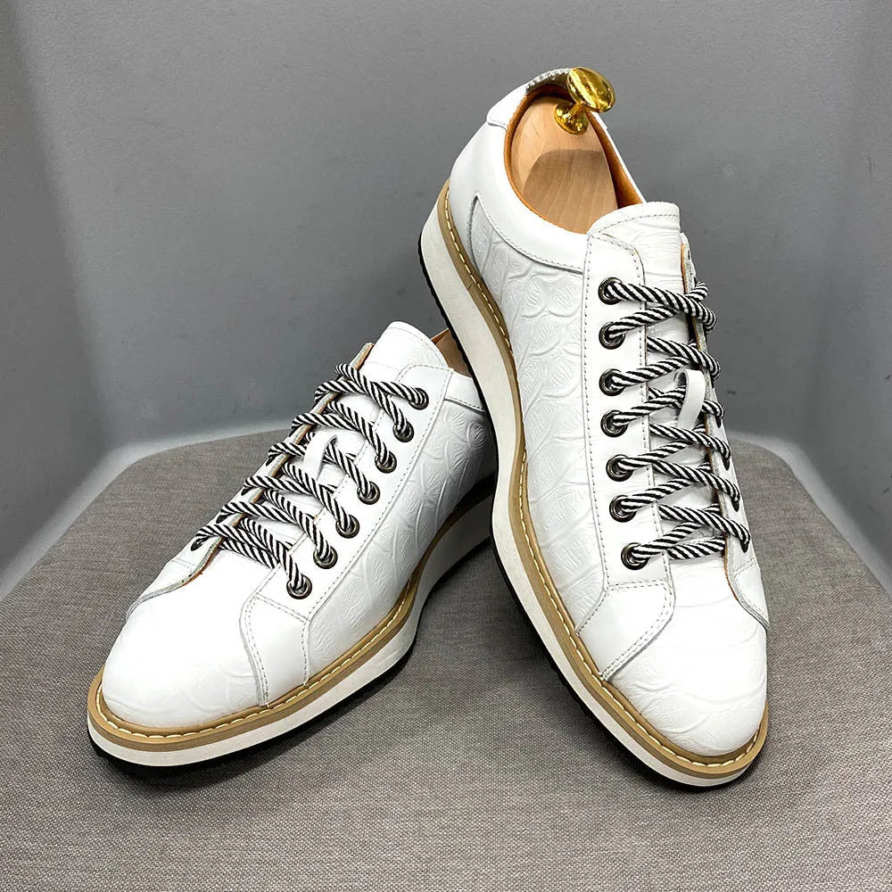 Men's black embossed pattern low-top lace-up trainers on a white background