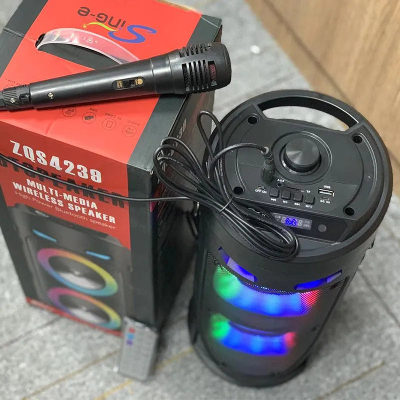 Black portable Bluetooth speaker with dual horn design and MP3 card slot on desktop