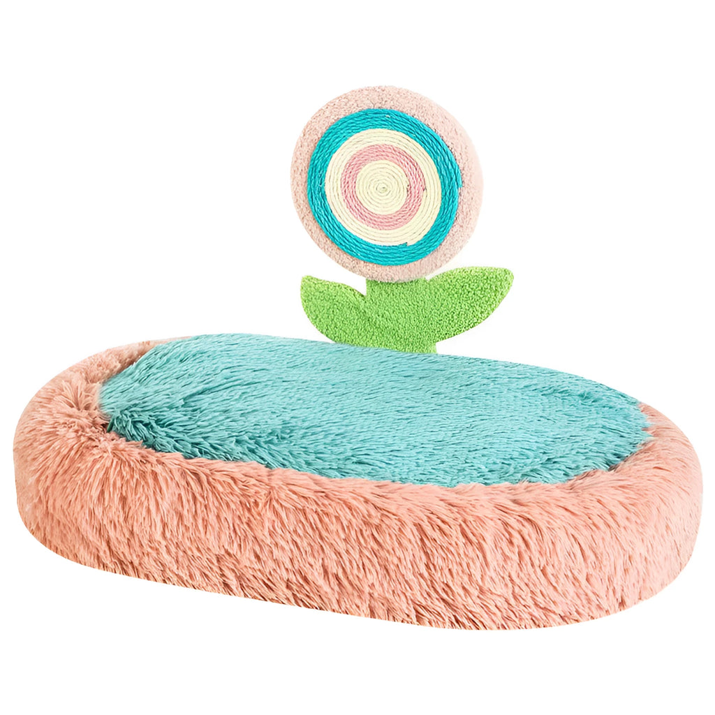 Pink elliptical plush cat bed with a removable, washable cover on a wooden floor.