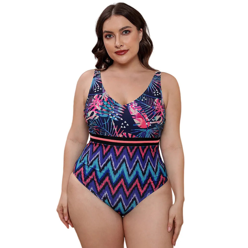 Women's blue printed one-piece swimsuit with spaghetti straps and a striped vest design.