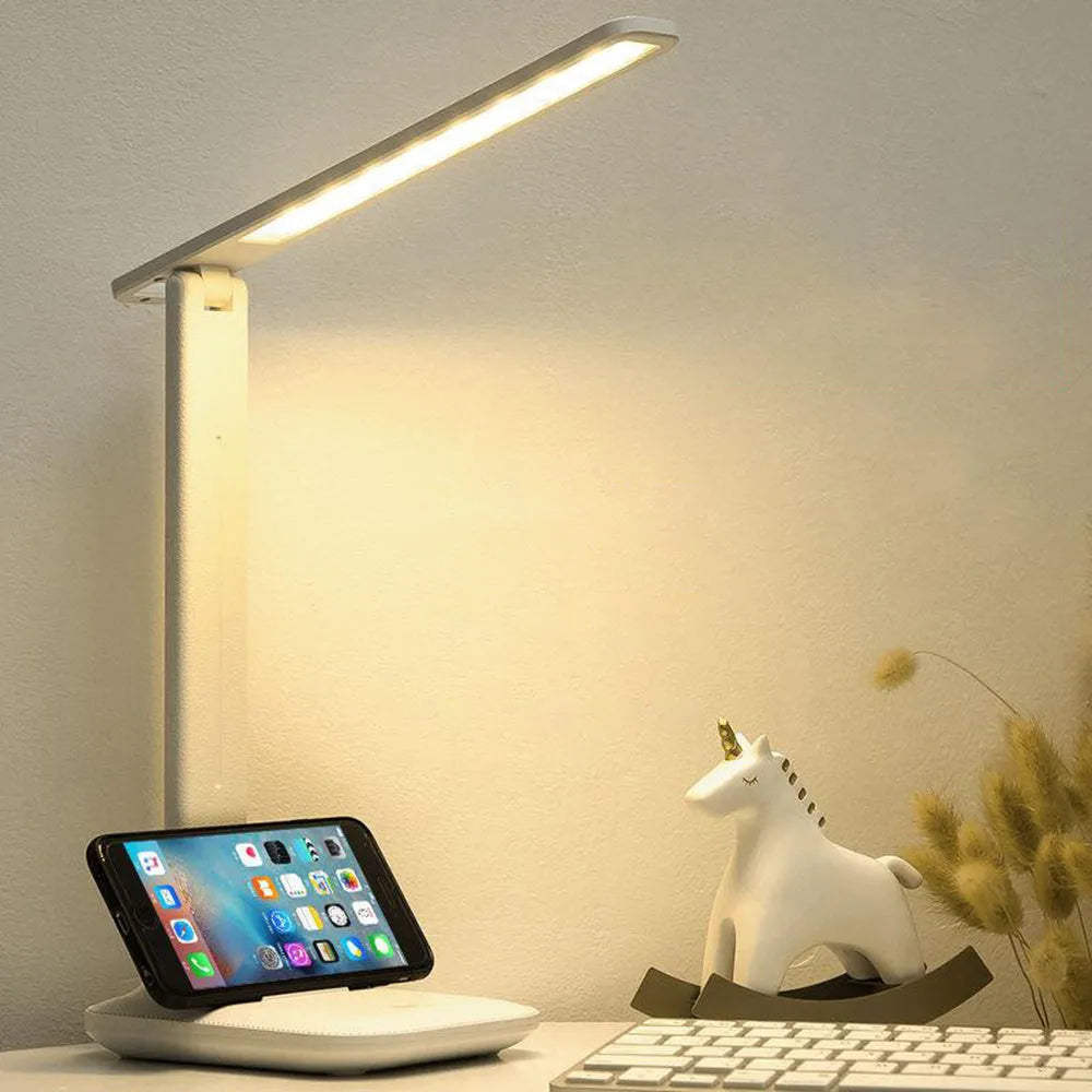White touch dimming colour-changing bedside lamp with USB charging cable.