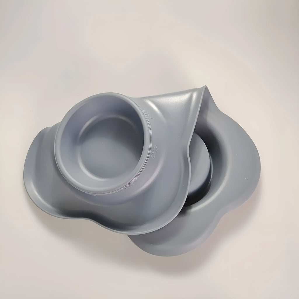 Large silicone double dog bowl with stainless steel inserts in blue colour showing two separate feeding compartments