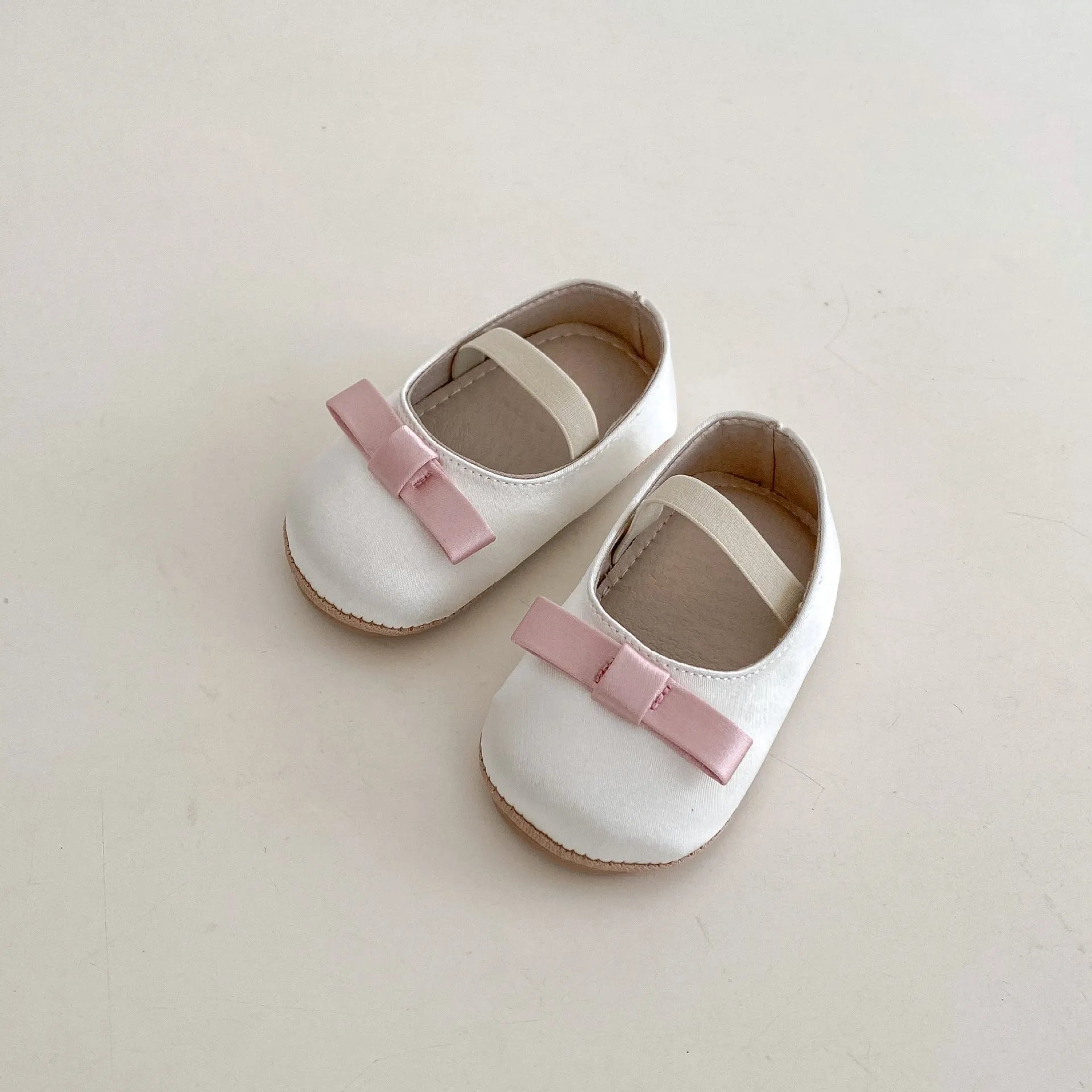 Cute baby butterfly knot shoes in solid colour with bow detail, breathable cloth and rubber sole