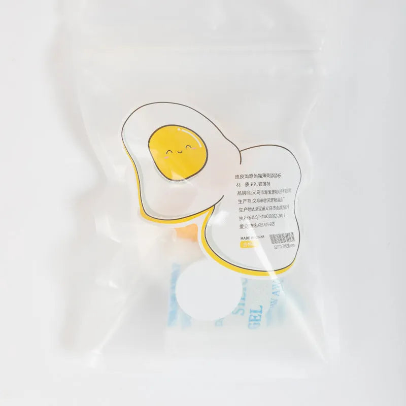 Interactive catnip ball toy in fried egg or poached egg shape with cute cat head design