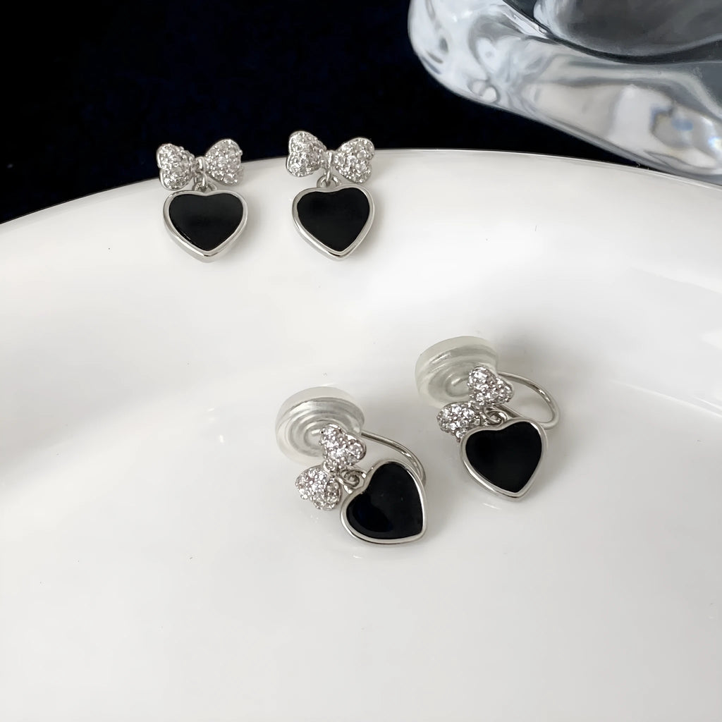 Pair of women's copper earrings, one heart-shaped and one bow-shaped, with micro-set zircon stones, ear clip and ear stud options