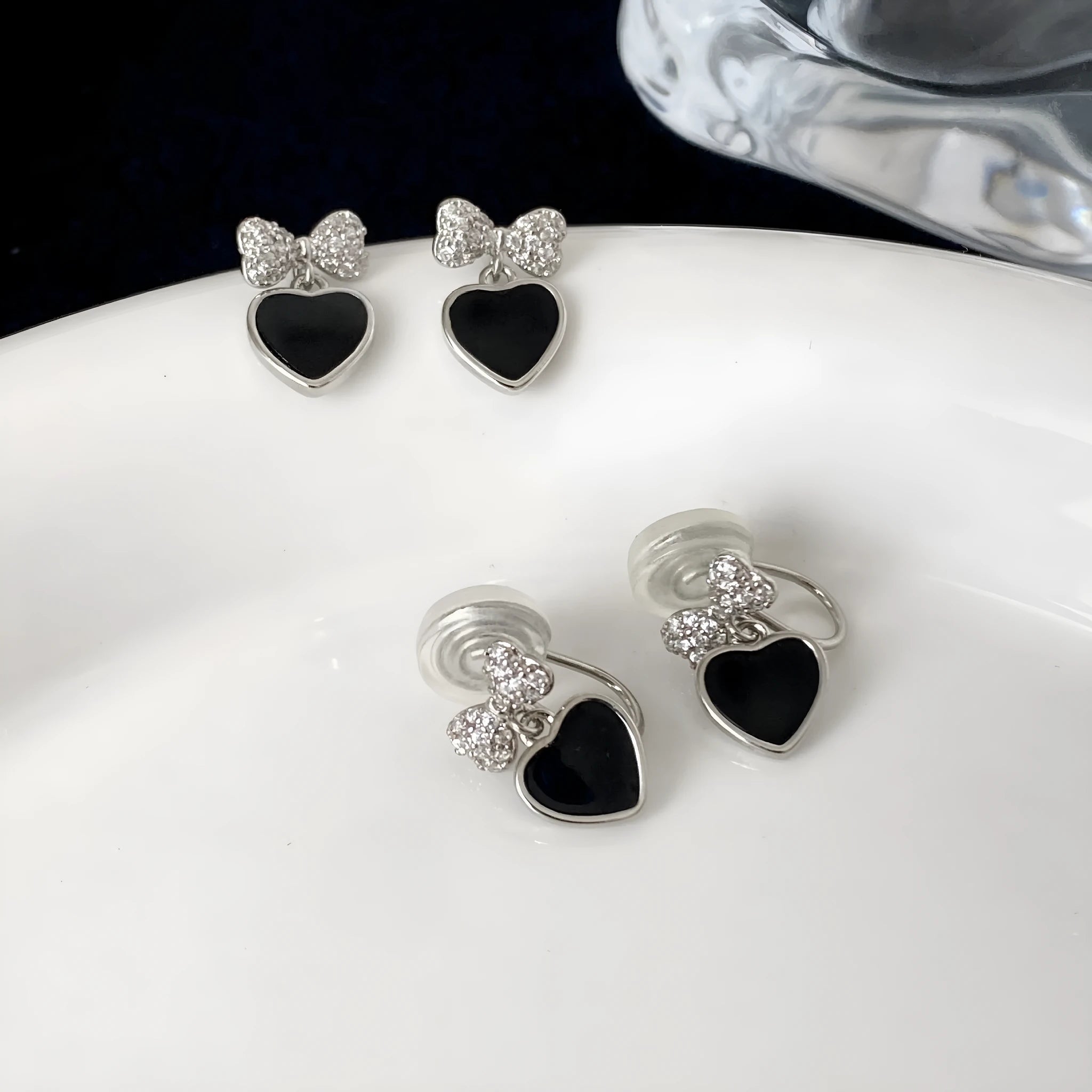 Pair of women's copper earrings, one heart-shaped and one bow-shaped, with micro-set zircon stones, ear clip and ear stud options