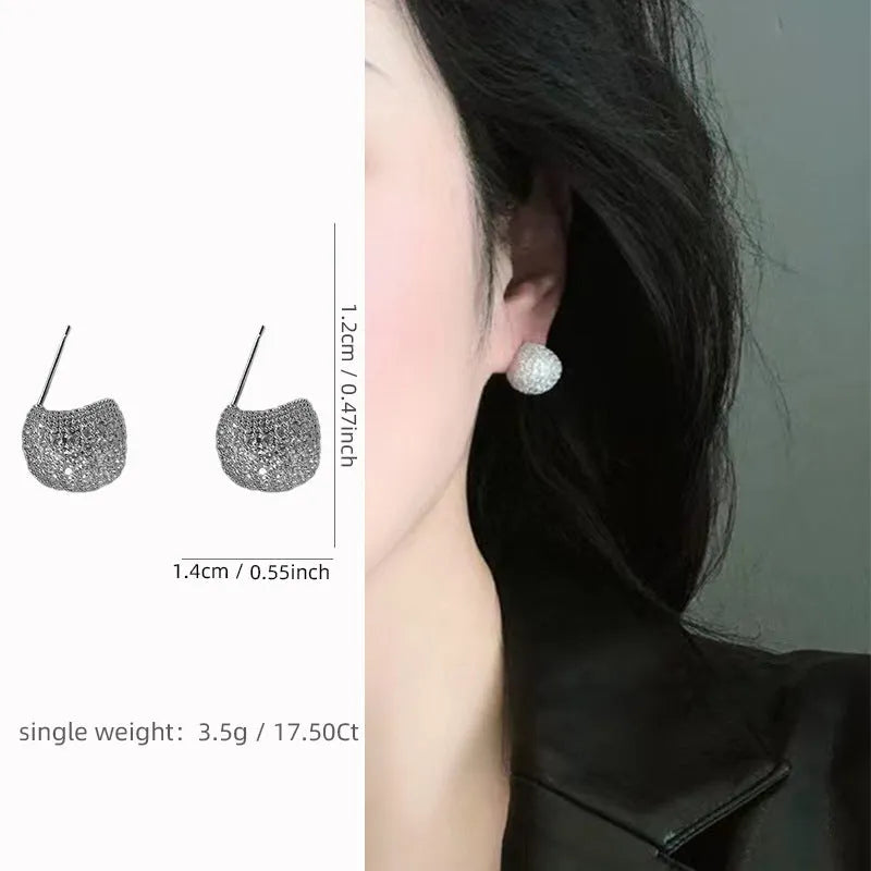 Geometric drop earrings with full diamond pave on golden spherical components in gold and white colour options