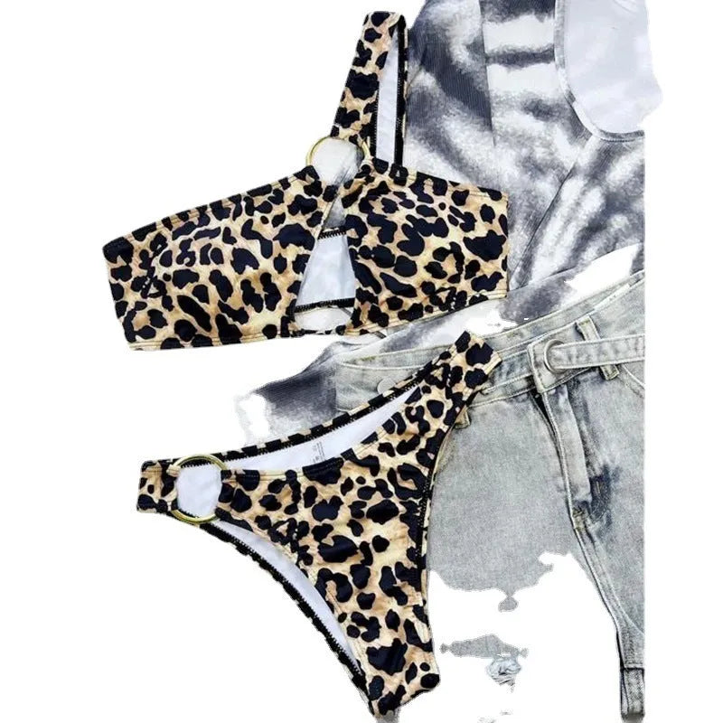 Women's leopard print bikini set with separate top and shorts on a mannequin
