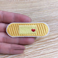 Ten colourful embroidered fabric patches with adhesive backing for clothing decoration