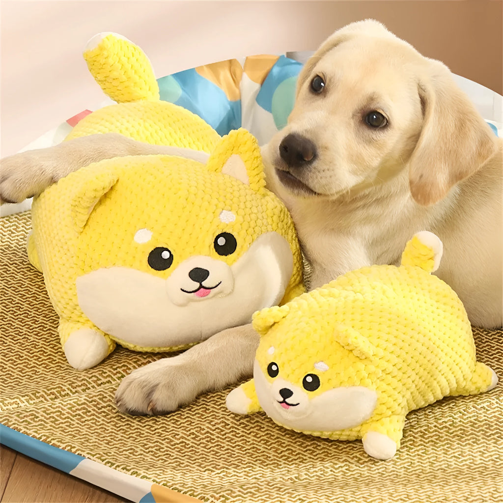 Plush calming dog toy with squeaker for chewing and anxiety relief, shown in large and medium sizes.
