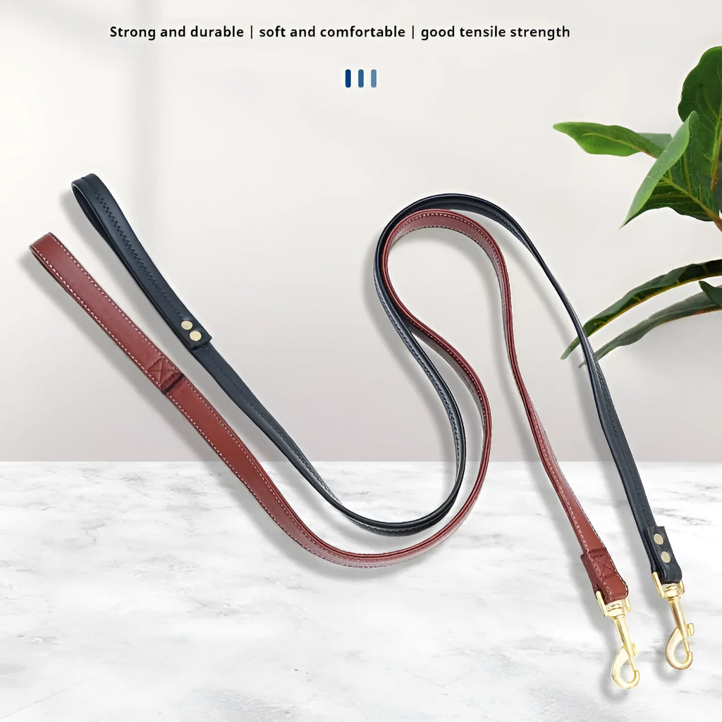 Black PU leather dog traction belt with metal clip, laid out to show length.