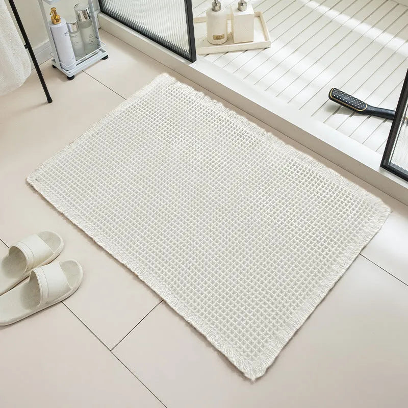 Checkered non-slip bathroom floor carpet in beige, available in multiple sizes from 43x61cm to 61x183cm