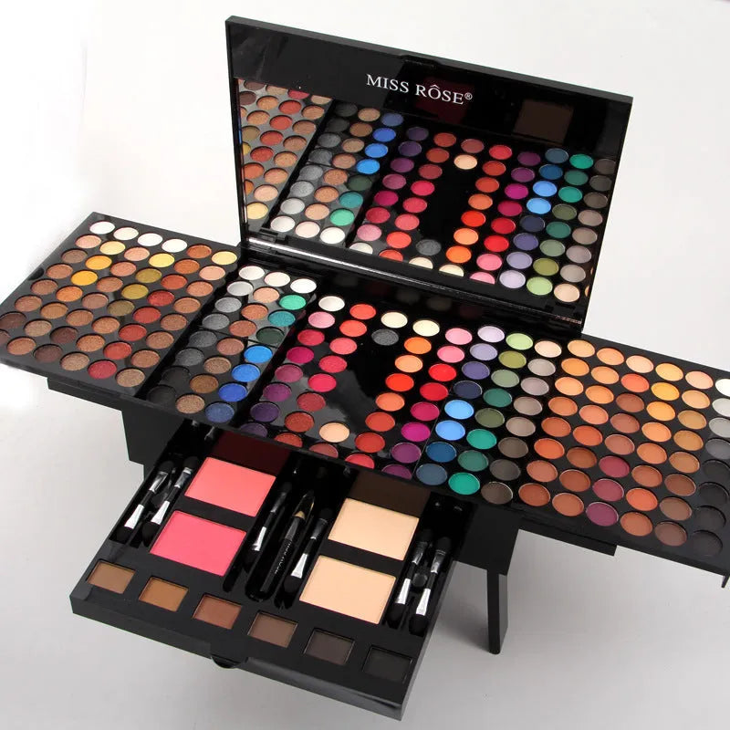 Piano-shaped makeup palette open showing 190 powder pans including eyeshadows, blushers and contour powders