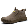 Mid-calf grey steel-toe safety work boots for welding and construction on a industrial floor.
