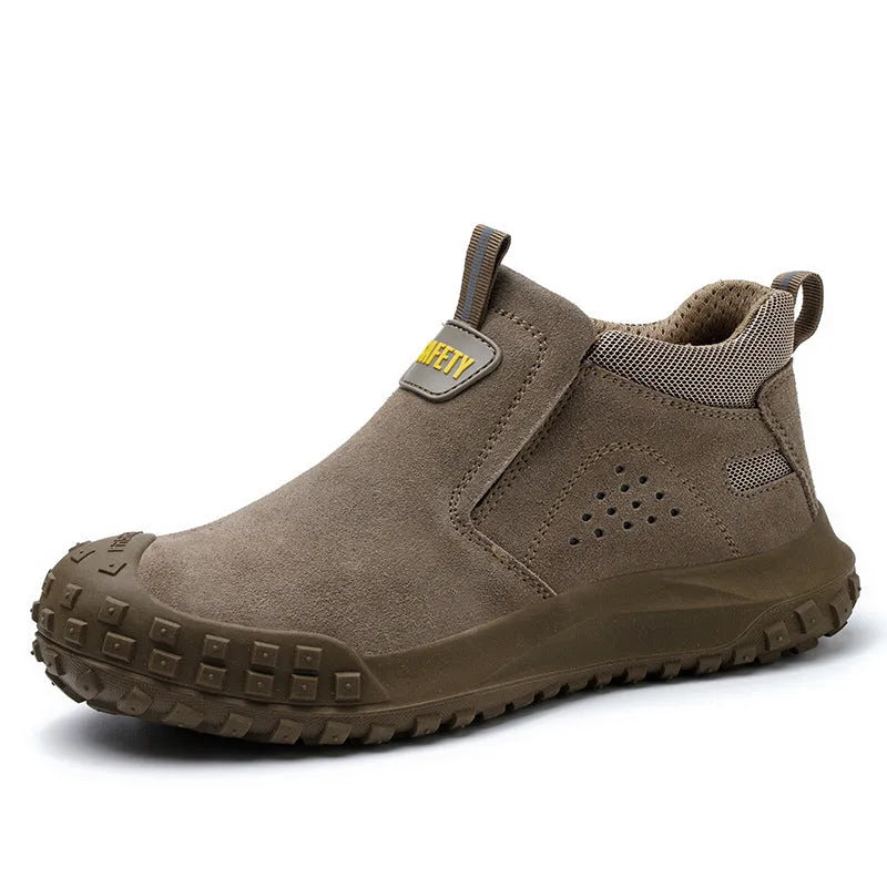 Mid-calf grey steel-toe safety work boots for welding and construction on a industrial floor.