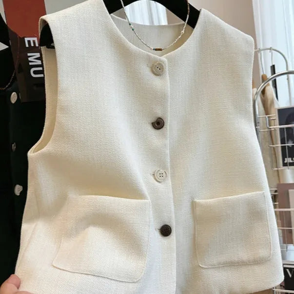 Women's sleeveless round neck vest in French bandage style, polyester fabric in milky white colour