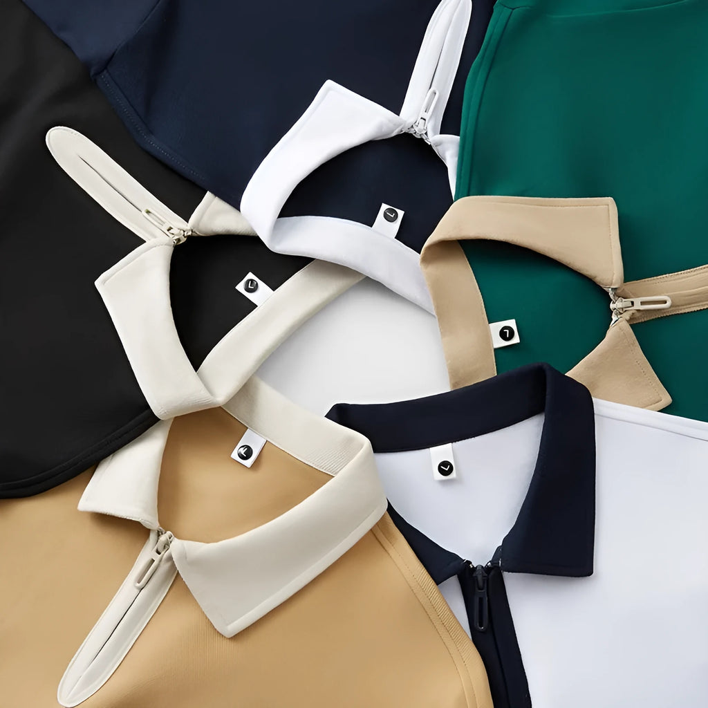 Short sleeve polo shirt with a zipper and lapel front in a solid colour, showing loose fit.