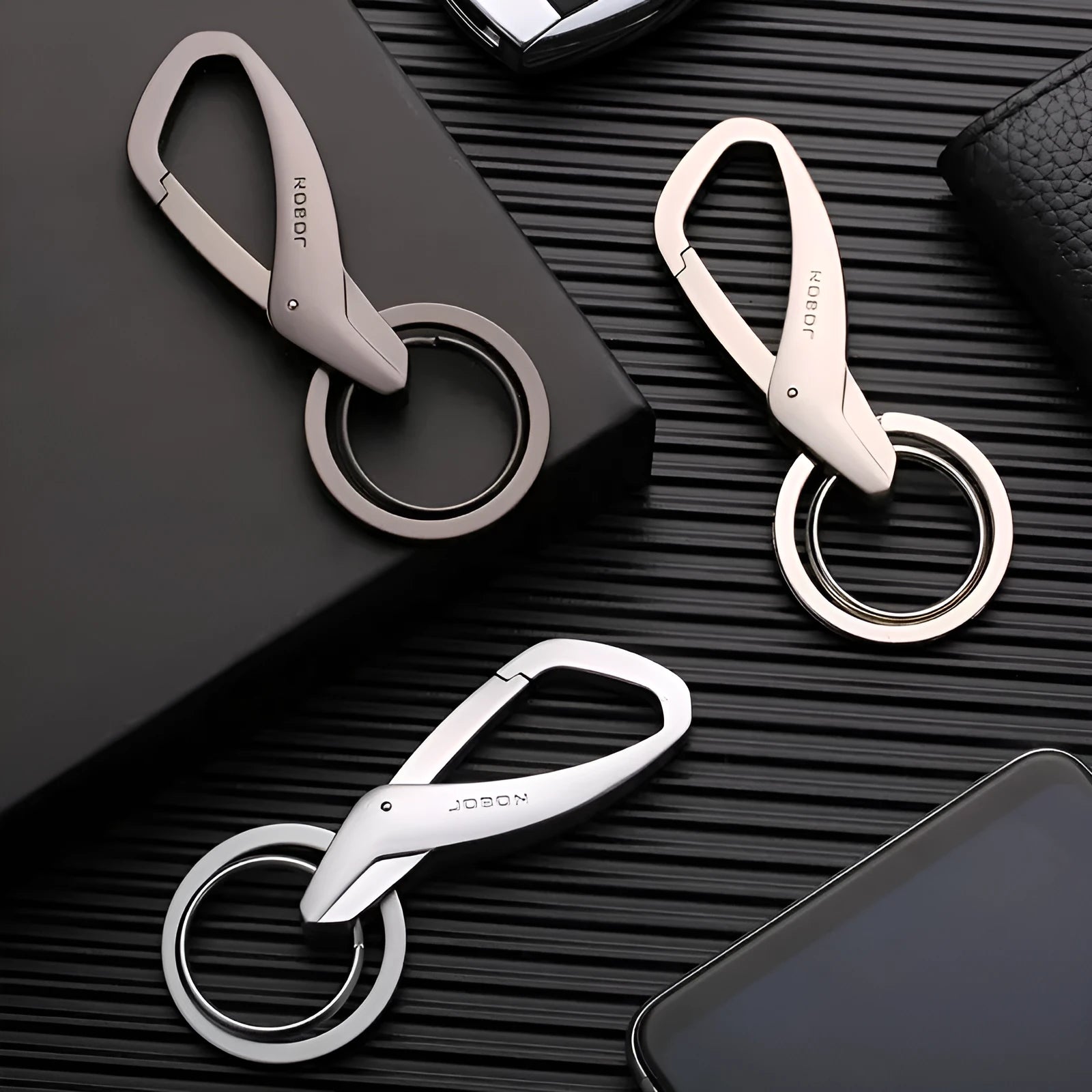 Simple metal double-ring key chain in black, chrome, or nickel finish on a waistband.
