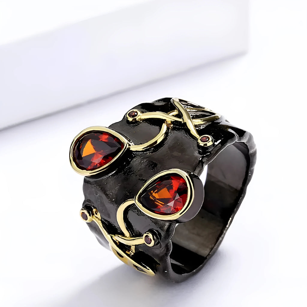 Retro women's straight-pull oval ring in brass with black finish, side view on light background