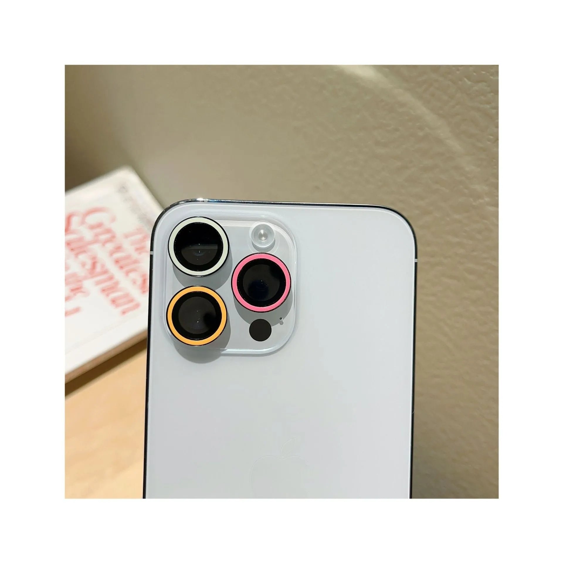HD tempered glass lens protector for iPhone 14 Pro Max with three-hole cutout, available in multiple colours