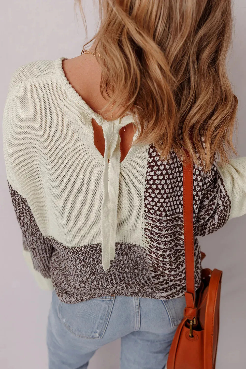 Dark khaki colour block women's long sleeve sweater with back tie detail and drop shoulders.