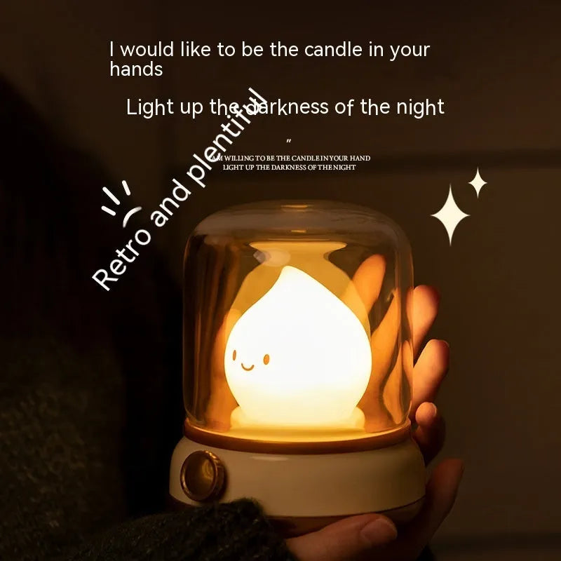 Green retro oil lamp design USB rechargeable LED desk night light on a wooden table.