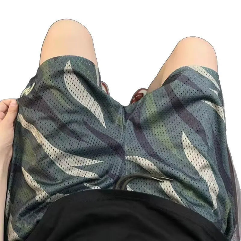Men's camouflage pattern straight-leg shorts in a cotton blend fabric on a neutral background.