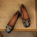 Low heel Mary Jane pumps with square toe, shallow mouth cut, and metal flat detail in Wanwan Lei style