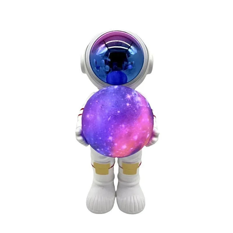 Spaceman starry sky projection lamp on surface showing star projection and speaker grille