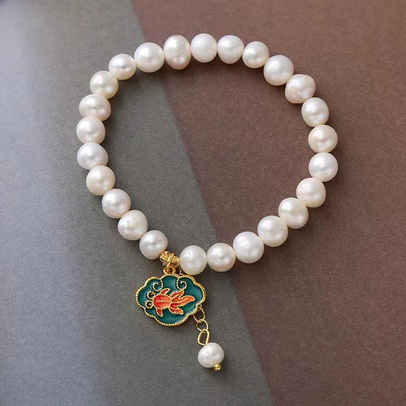 White freshwater pearl goldfish and lotus bracelet with vintage baroque design on delicate chain