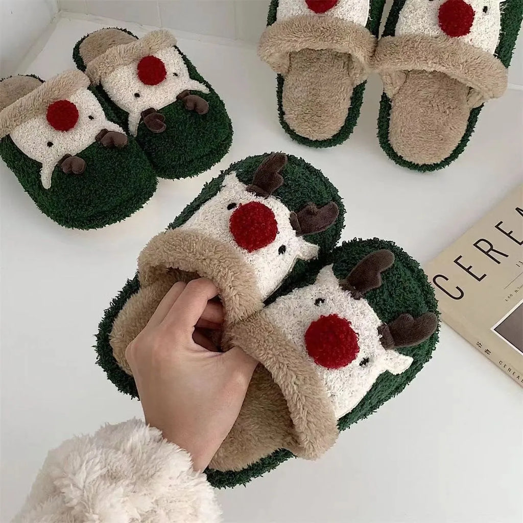 Women's Christmas deer patterned cotton slippers with anti-slip soles in brown, pink and green colours.