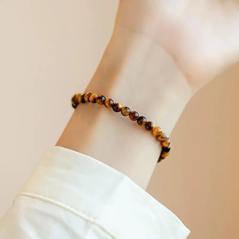 Tigereye stone bracelet with geometric design showing round beads in new Chinese style