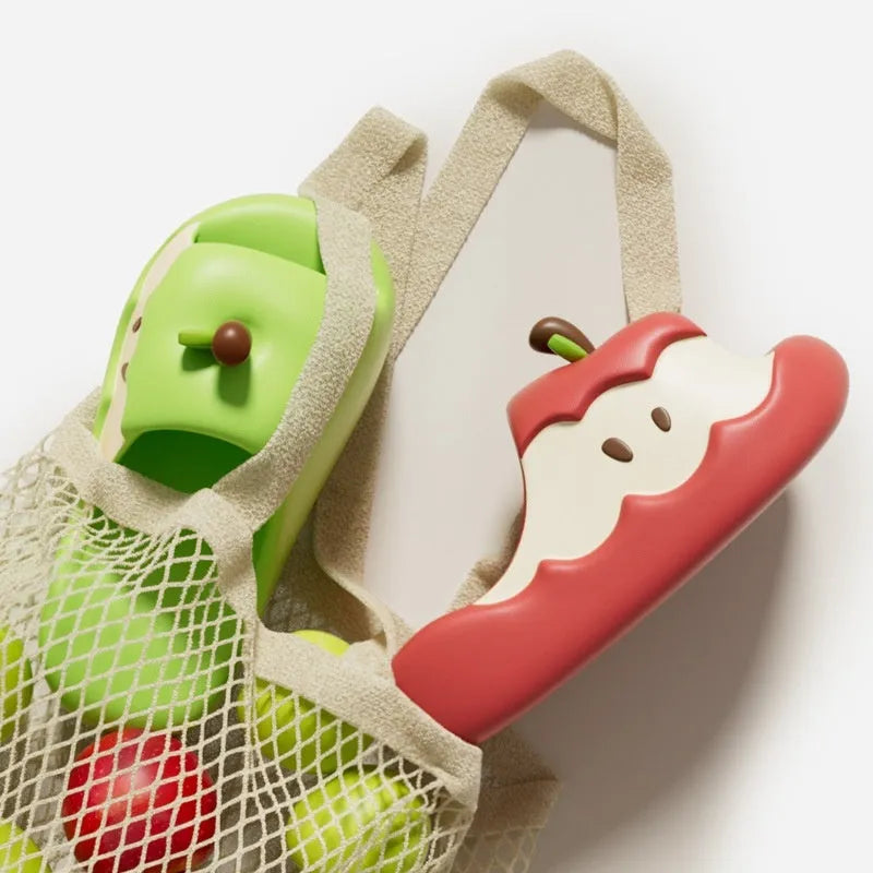 Pair of fruit-themed cartoon EVA flip flop sandals for parent-child home wear on a light background.