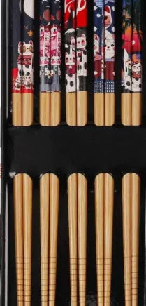 Set of five pairs of bamboo chopsticks with colourful Japanese lucky cat and elegant blue patterns.