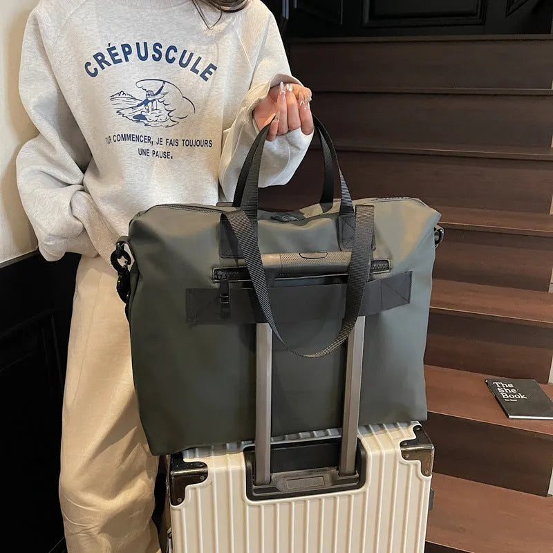 Lightweight Oxford cloth tote bag in black, grey, or champagne with 20-35L capacity for travel