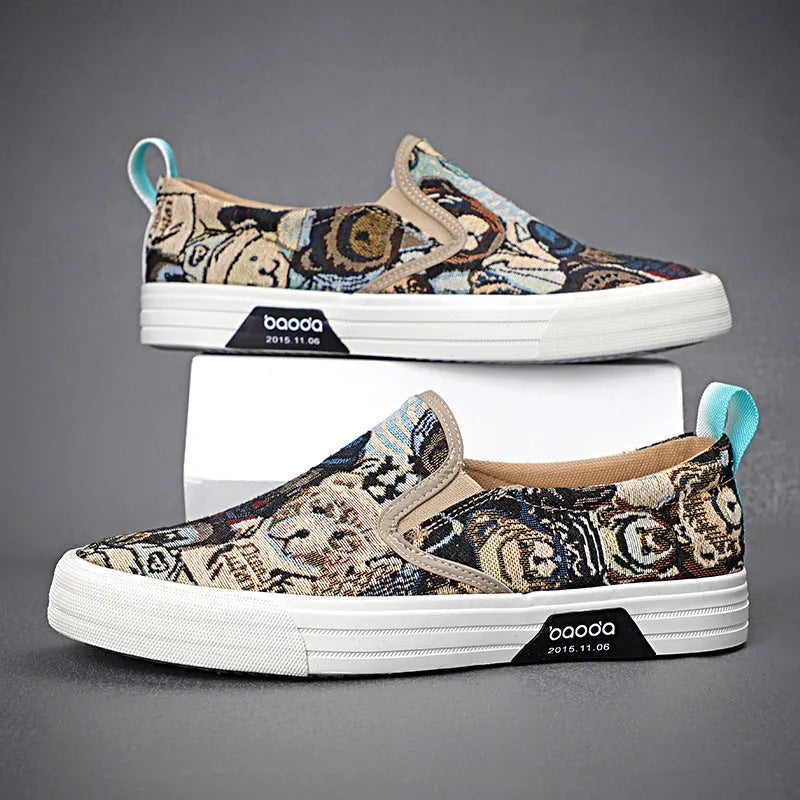 A pair of low-top canvas slip-on sneakers with a round toe and vulcanised rubber sole on a neutral background.