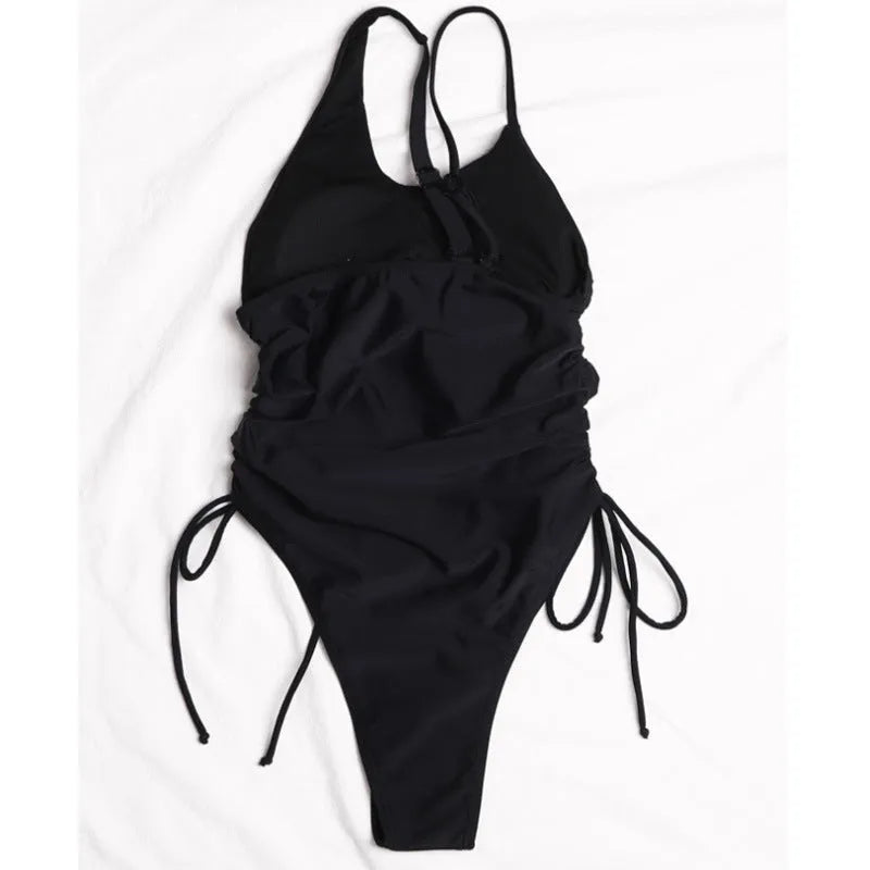 Black women's sleeveless dress with sloping shoulders and tight-fitting bodycon style