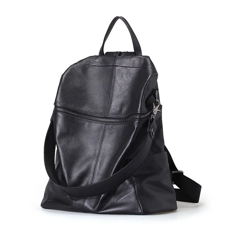 Women's genuine leather retro backpack showing internal organisation compartments and sewing thread detailing