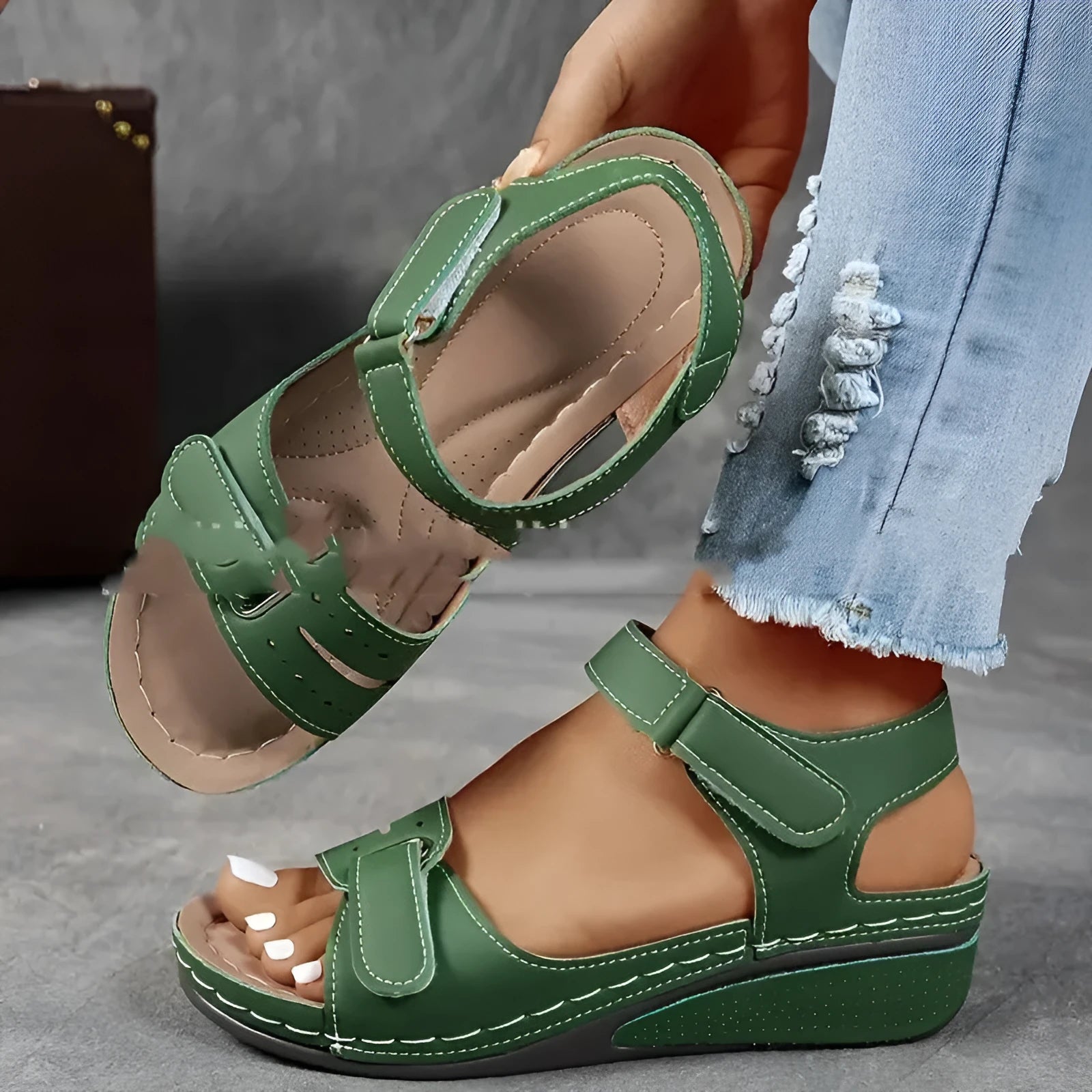 Beige wide fit sandals with thick composite sole and adjustable Velcro straps on a white background.