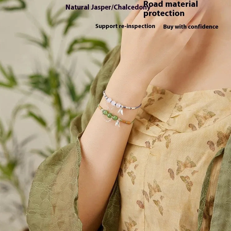 Hetian jade bracelet with diamond weave and lotus design in light green or haze blue