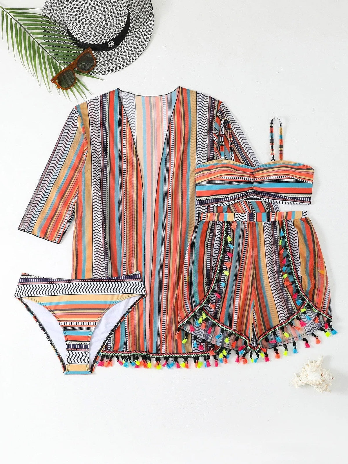Women's four-piece print swimsuit set with halter straps and tassel details in picture colour