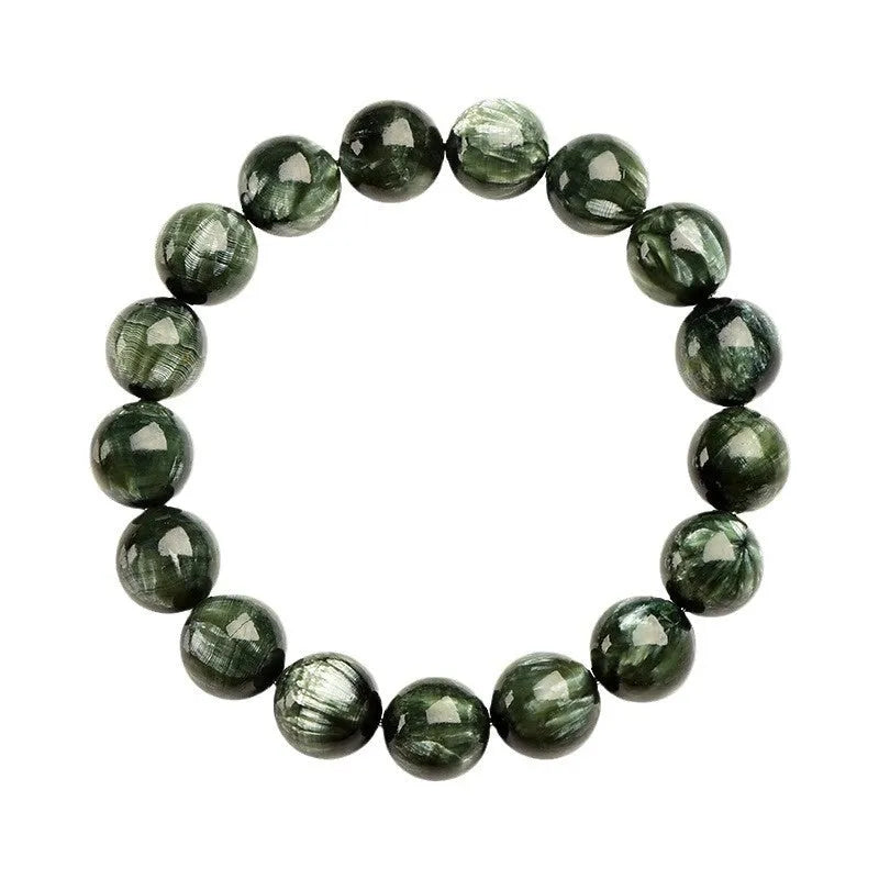 Green dragon crystal bracelet with round beads and a ruyi charm on a wrist.