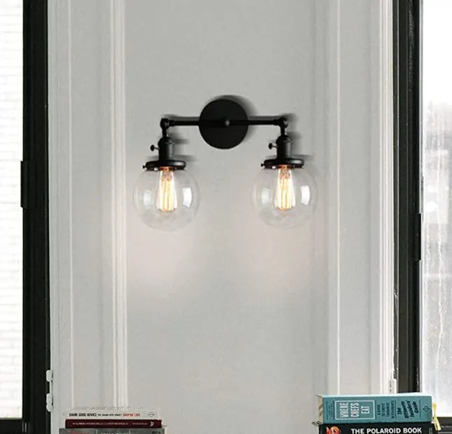 Double headed industrial wall lamp with spherical glass shades, iron black finish, 15x12x24cm