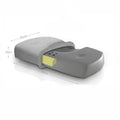 Grey memory foam massage pillow with knitted cotton cover on a bed, offering adjustable neck support for sleep
